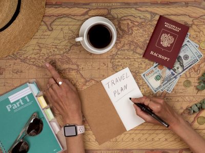 Planning vacation, travel plan, trip vacation using world map with accessories. Top view, flat lay.